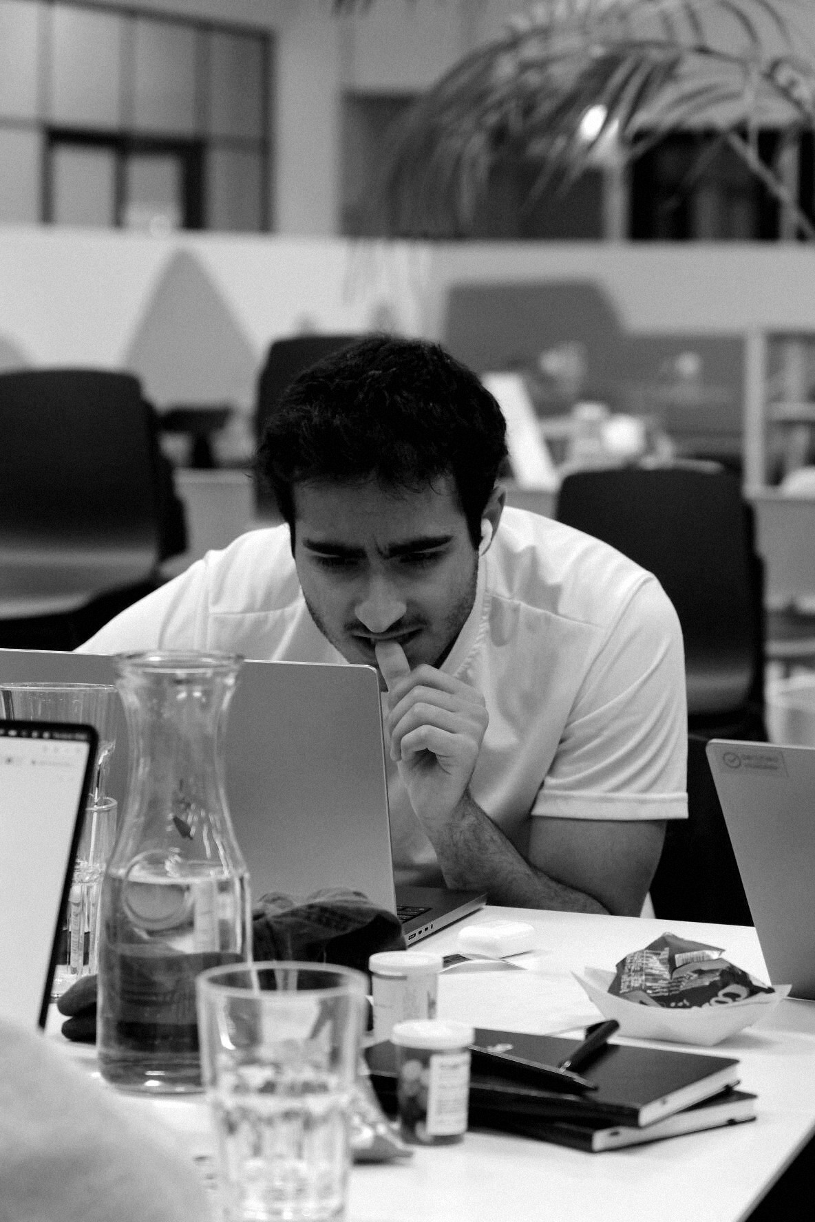 An attendee concentrating on a laptop at the Munich Finance Hackathon