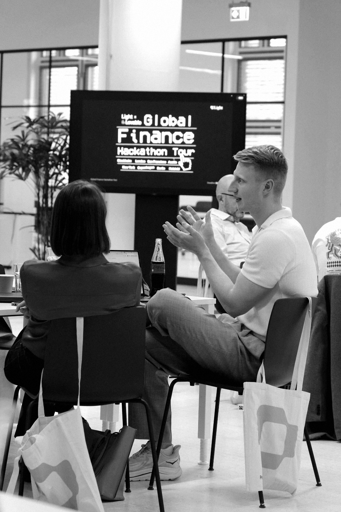 Participants discussing their work around a table at Personio HQ