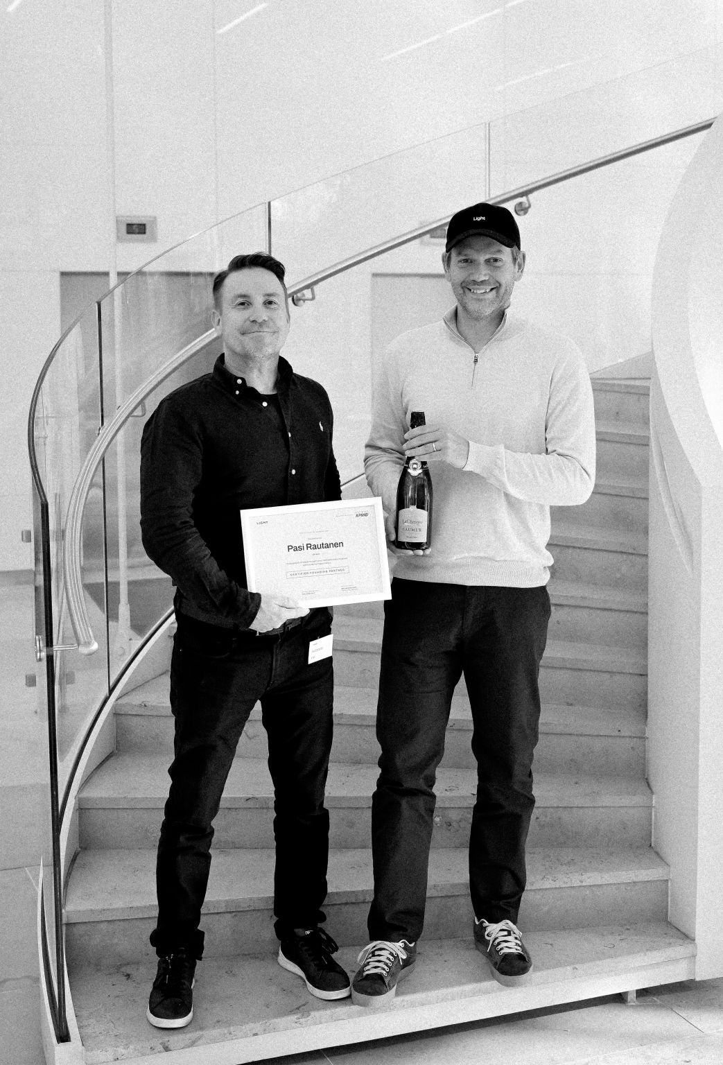 Pasi Rautanen of KPMG holding his Light certified founding partner certificate