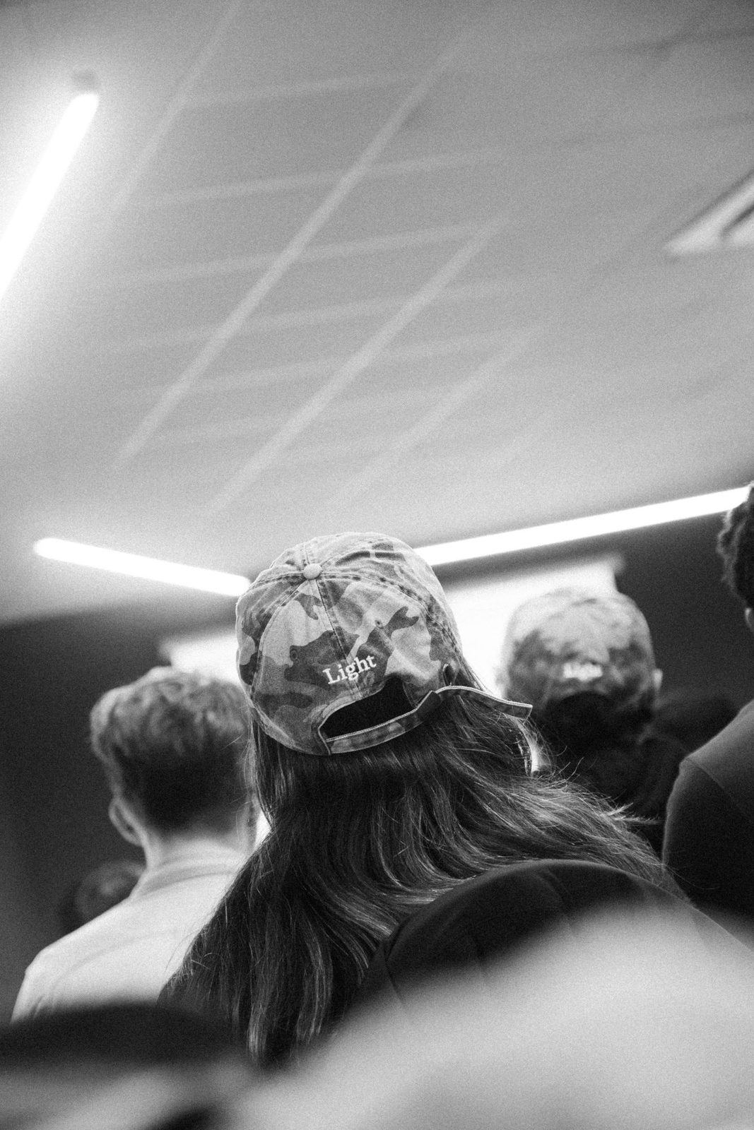 A Lighter in a camouflage Light cap in the crowd at Starsite X