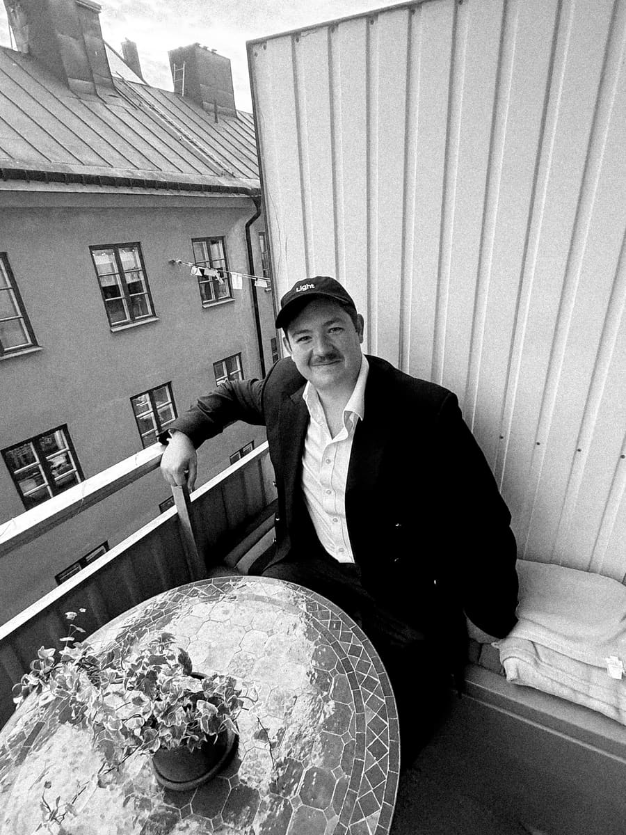 A teammate relaxing on a rooftop terrace overlooking the city