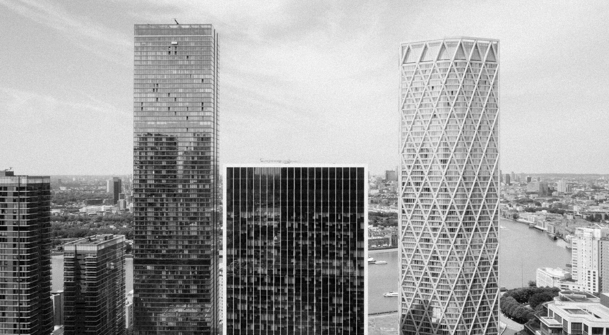 Office towers over a river on a clear day